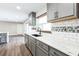 Updated kitchen with stainless appliances, modern countertops and subway tile backsplash at 2080 Attache Ct, Clearwater, FL 33764
