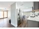 Bright kitchen with stainless steel appliances, marble countertops, and dark gray cabinetry at 2080 Attache Ct, Clearwater, FL 33764