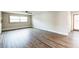 Inviting living room with a large window and neutral walls. The room is spacious and ready for decor at 2080 Attache Ct, Clearwater, FL 33764