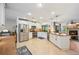 Well-lit kitchen featuring stainless steel appliances, granite counters, and ample cabinet space at 23417 Pine Lake St, Land O Lakes, FL 34639