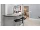 Stylish kitchen view from bar featuring dark granite counters and modern stainless steel appliances at 2519 Southern Oak Cir, Clearwater, FL 33764