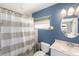 Bathroom showcasing a vanity, toilet, and bathtub with a shower at 2519 Southern Oak Cir, Clearwater, FL 33764