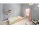 Bright bedroom featuring a soft color scheme, wooden toddler bed and charming decor at 2519 Southern Oak Cir, Clearwater, FL 33764