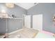 Cozy bedroom showcasing a light color palette, wood flooring and lots of closet space at 2519 Southern Oak Cir, Clearwater, FL 33764