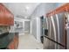 Charming kitchen features wood cabinetry, stainless steel appliances, and granite countertops at 2519 Southern Oak Cir, Clearwater, FL 33764