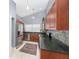 Well-equipped kitchen featuring stainless steel appliances and dark countertops at 2519 Southern Oak Cir, Clearwater, FL 33764