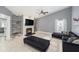 Bright living room featuring stylish seating, floating shelves, and a modern fireplace at 2519 Southern Oak Cir, Clearwater, FL 33764