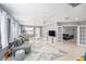 Spacious living room with neutral paint, ceiling fans, and French doors to a separate space at 2519 Southern Oak Cir, Clearwater, FL 33764