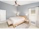 Inviting main bedroom with a ceiling fan, natural light, and modern furniture at 2519 Southern Oak Cir, Clearwater, FL 33764
