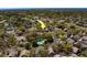 An aerial view of houses nestled among lush trees and green spaces in the community at 2847 Rampart Cir, Clearwater, FL 33761