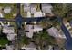 An aerial shot of homes with well-maintained lawns in a tree-lined neighborhood at 2847 Rampart Cir, Clearwater, FL 33761