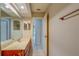 Bathroom featuring a double vanity, large mirror and access to other rooms at 2847 Rampart Cir, Clearwater, FL 33761