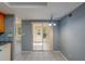 Bright dining area with sliding doors to the lanai and kitchen access at 2847 Rampart Cir, Clearwater, FL 33761
