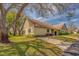 Charming single-story home with well-maintained lawn, mature trees and inviting curb appeal at 2847 Rampart Cir, Clearwater, FL 33761