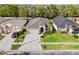 Beautiful aerial view of a well-maintained home with a lush green lawn and a spacious driveway at 31123 Stone Arch Ave, Wesley Chapel, FL 33545