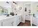 Bright bathroom featuring double sinks, a large mirror, and modern fixtures at 31123 Stone Arch Ave, Wesley Chapel, FL 33545