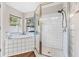 Elegant bathroom showcasing a soaking tub, separate shower, and stylish tile work at 31123 Stone Arch Ave, Wesley Chapel, FL 33545