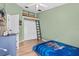 Fun bedroom with a loft and ladder perfect for , on a hardwood floor at 31123 Stone Arch Ave, Wesley Chapel, FL 33545