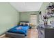 Cozy bedroom with a twin bed, and organized shelves at 31123 Stone Arch Ave, Wesley Chapel, FL 33545
