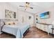Bright bedroom with neutral walls, wood-look floors, and a cozy atmosphere at 31123 Stone Arch Ave, Wesley Chapel, FL 33545
