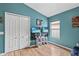 Bedroom featuring a closet, hardwood floors, and modern style wall mounted TVs at 31123 Stone Arch Ave, Wesley Chapel, FL 33545