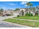 Charming single-Gathering home with a well-manicured lawn, attached garage, and inviting curb appeal at 31123 Stone Arch Ave, Wesley Chapel, FL 33545