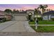 Charming single-story home with a well-manicured lawn, two-car garage, and inviting front entrance at 31123 Stone Arch Ave, Wesley Chapel, FL 33545