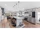 Modern kitchen with stainless steel appliances, a center island, and hardwood flooring at 31123 Stone Arch Ave, Wesley Chapel, FL 33545