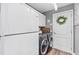 Laundry room features a washer, dryer, and plenty of storage space, for convenience at 31123 Stone Arch Ave, Wesley Chapel, FL 33545