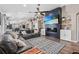Open living area featuring a fireplace, built-in shelving, and seamless access to other rooms at 31123 Stone Arch Ave, Wesley Chapel, FL 33545