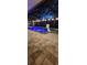 Gorgeous pool with basketball hoop and fountains, surrounded by a screened enclosure and stone pavers, provides a relaxing retreat at 31123 Stone Arch Ave, Wesley Chapel, FL 33545