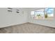 Bright bedroom with natural light, carpet floors, and large windows with a view at 32335 Wetland Bird Vw, San Antonio, FL 33576