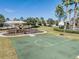Community basketball court with a gazebo, park benches, landscaping, and a grassy area at 33899 Astoria Cir, Wesley Chapel, FL 33545