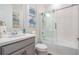 Modern bathroom with gray vanity and shower-tub combination at 33899 Astoria Cir, Wesley Chapel, FL 33545