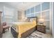 Well-decorated bedroom with accent wall and bedside table at 33899 Astoria Cir, Wesley Chapel, FL 33545