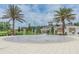 Community splash pad and pool area with palm trees, providing a fun and refreshing space for residents on sunny days at 33899 Astoria Cir, Wesley Chapel, FL 33545