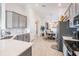 Modern kitchen with gray cabinets, white countertops, and stainless steel appliances at 33899 Astoria Cir, Wesley Chapel, FL 33545