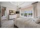 Spacious main bedroom with water view and modern decor at 33899 Astoria Cir, Wesley Chapel, FL 33545
