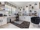Bright home office featuring custom built-ins, a spacious desk, and a patterned accent rug at 33899 Astoria Cir, Wesley Chapel, FL 33545