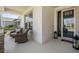 Cozy front porch featuring stylish seating and a welcoming entrance to the home at 33899 Astoria Cir, Wesley Chapel, FL 33545