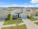 Aerial view of the house showcasing its landscaping, driveway, and the surrounding neighborhood at 35592 Stella Vast Dr, Zephyrhills, FL 33541