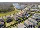 The aerial view showcases a Gathering-friendly neighborhood near a lake, offering a serene suburban lifestyle at 3991 Mellon Dr, Odessa, FL 33556