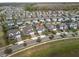 An aerial view highlights a desirable property in a neighborhood with manicured lawns and inviting curb appeal at 3991 Mellon Dr, Odessa, FL 33556