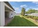 Lush backyard with well-maintained lawn, tidy landscaping and privacy fence at 3991 Mellon Dr, Odessa, FL 33556