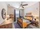 Charming bedroom featuring a blue accent rug, wood furnishings, and playful decor at 3991 Mellon Dr, Odessa, FL 33556