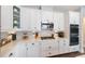 Updated kitchen featuring stainless steel appliances, white cabinets, and quartz countertops at 3991 Mellon Dr, Odessa, FL 33556