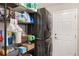 Compact laundry room with a stacked washer and dryer, wire shelving, and ample storage space at 3991 Mellon Dr, Odessa, FL 33556