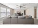 The living room includes a gray sofa and a media center with a television at 3991 Mellon Dr, Odessa, FL 33556