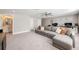 Spacious living room featuring a plush sectional sofa, and lots of natural light at 3991 Mellon Dr, Odessa, FL 33556