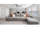 Bright living room featuring a sectional sofa, ceiling fan and plenty of natural light at 3991 Mellon Dr, Odessa, FL 33556